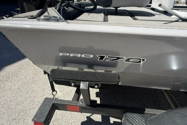 Slide: The Image of 2027 Tracker Pro 170 boat on trailer, showcasing sleek design and branding. - 38