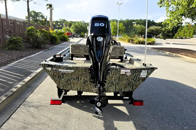 Slide: The Image of 2027 Tracker Grizzly 1754 SC boat with camouflage design and 60 HP motor. - 42