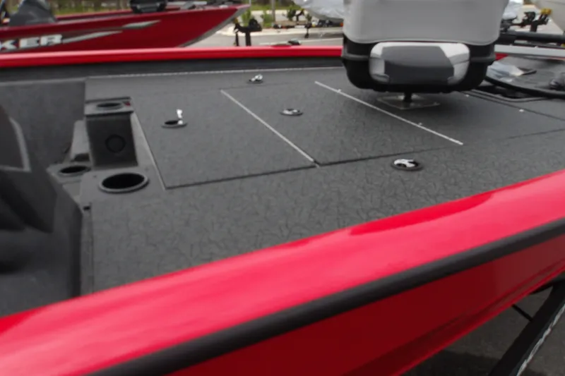 Slide: The Image of 2027 Tracker Pro Team 195 boat deck with red trim and storage compartments. - 17