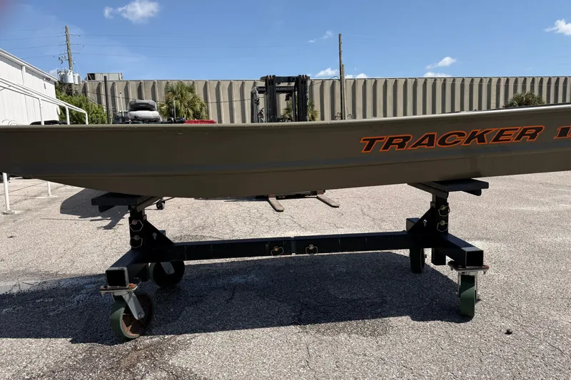 The Image of 2027 Tracker Grizzly 12 Jon boat on wheeled stand, outdoor setting. - 0