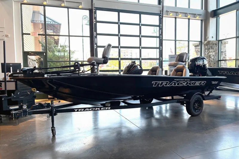 The Image of 2027 Tracker Pro Team 190 boat displayed indoors, featuring sleek design and modern amenities. - 0