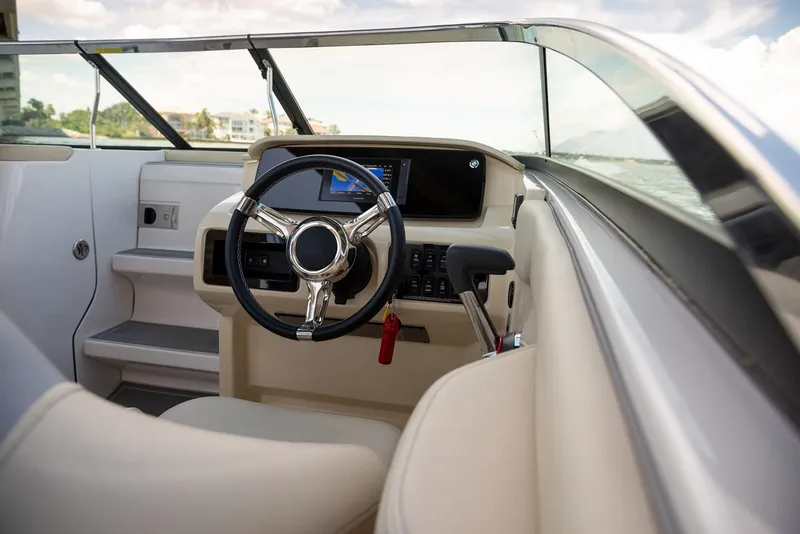Slide: The Image of Manufacturer Provided Image: 2026 Regal LS4C boat interior with steering wheel and dashboard, featuring modern design and controls. - 6
