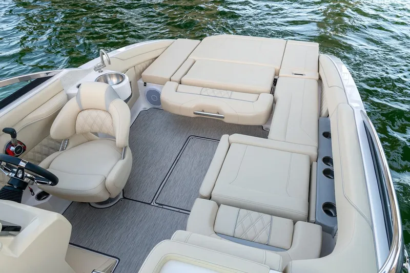 Slide: The Image of Manufacturer Provided Image: Luxurious 2026 Regal LS4C boat interior with beige seating and water view. - 8