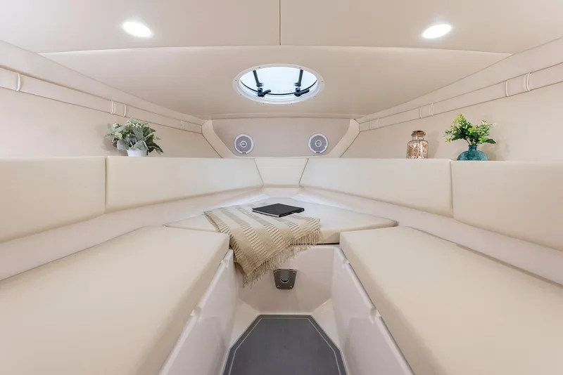 Slide: The Image of Manufacturer Provided Image: Luxurious interior of 2026 Regal LS4C boat with elegant seating and decor. - 12