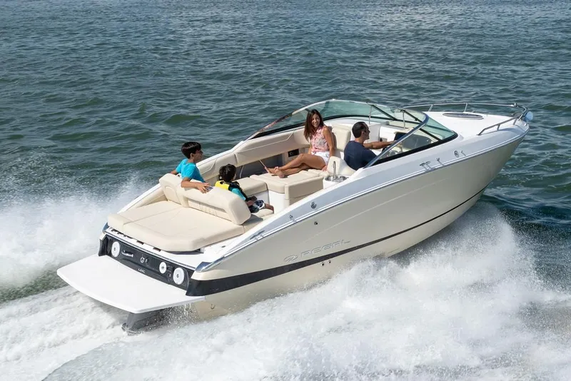 Slide: The Image of Manufacturer Provided Image: 2026 Regal LS4C boat cruising on water with passengers enjoying the ride. - 2