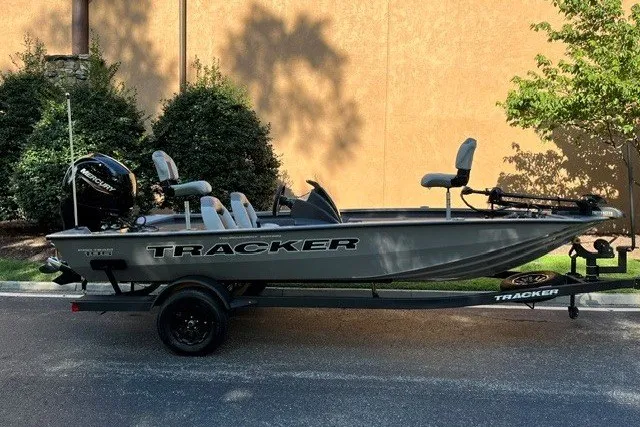 The Image of 2027 Tracker Pro Team 195 boat on trailer, parked outdoors. - 0
