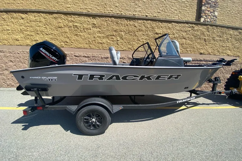 The Image of 2027 Tracker Pro Guide V-16 WT boat on trailer, side view. - 0