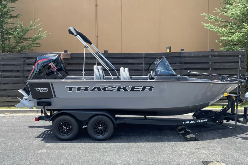 The Image of 2027 Tracker Targa V-18 Combo boat on trailer, parked outdoors. - 0