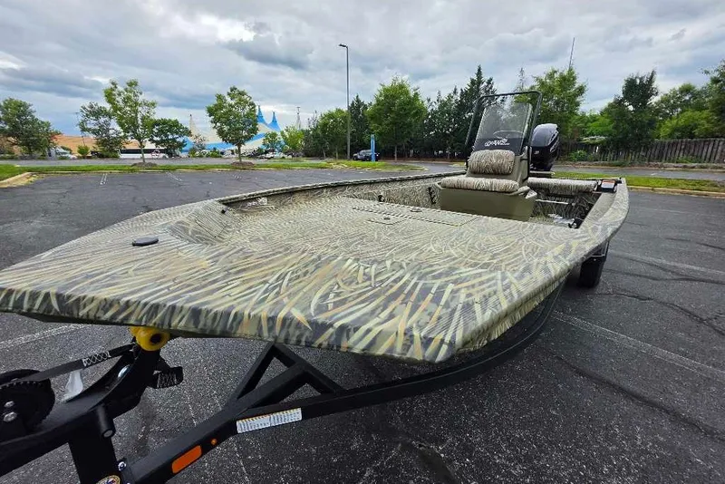 The Image of 2027 Tracker Grizzly 1860 CC boat with camouflage design in a parking lot. - 0
