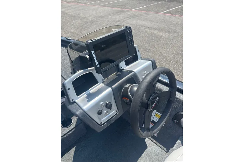 Slide: The Image of Steering console of 2027 Tracker Pro Team 195 boat with Lowrance display. - 14