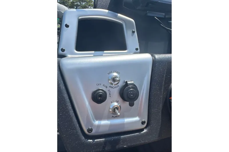 Slide: The Image of Control panel of 2027 Tracker Pro Team 195 boat with switches and ignition. - 15