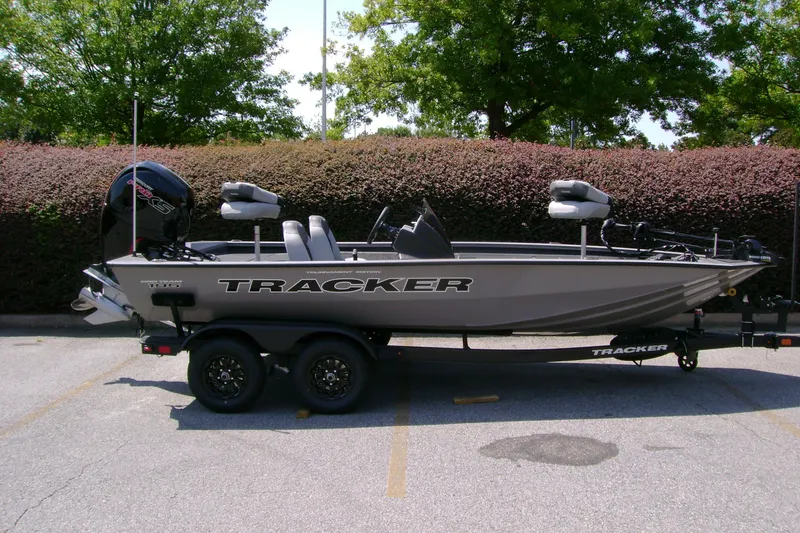 The Image of 2027 Tracker Pro Team 195 boat on trailer, parked outdoors. - 0
