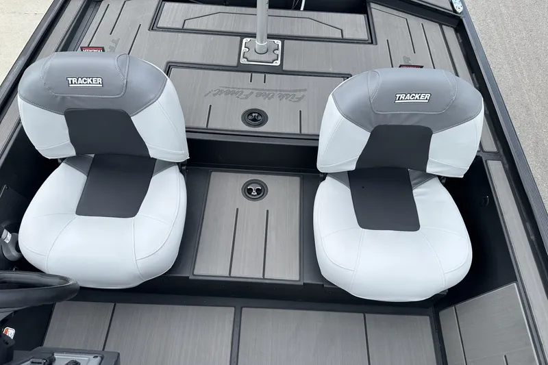 Slide: The Image of 2027 Tracker Pro 170 boat interior with two cushioned seats. - 15