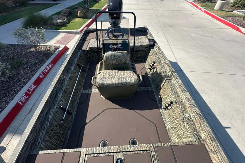 Slide: The Image of 2027 Tracker Grizzly 1860 CC boat with camo seating and spacious deck. - 14