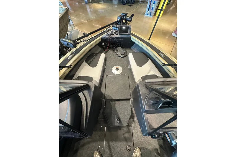 Slide: The Image of 2027 Tracker Targa V-18 Combo boat interior with seating and navigation equipment. - 26