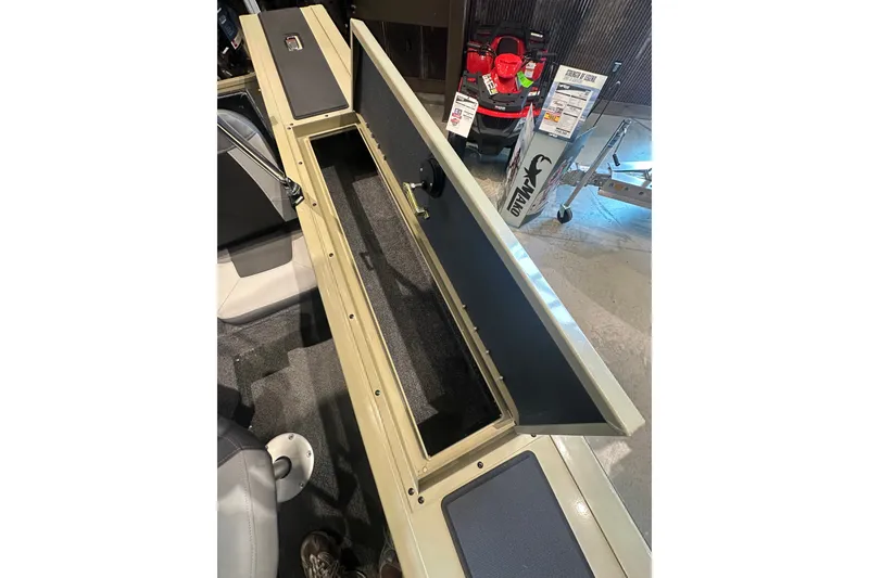 Slide: The Image of 2027 Tracker Targa V-18 Combo boat interior storage compartment open for viewing. - 30