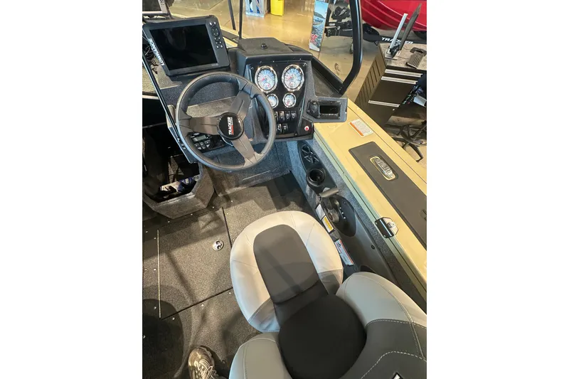Slide: The Image of Interior view of 2027 Tracker Targa V-18 Combo boat cockpit with steering wheel and dashboard. - 17
