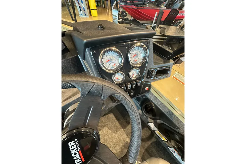 Slide: The Image of Dashboard of 2027 Tracker Targa V-18 Combo boat with gauges and steering wheel. - 24