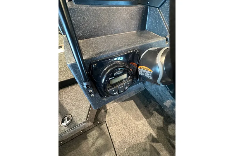 Slide: The Image of 2027 Tracker Targa V-18 Combo boat dashboard with control panel and steering wheel. - 32
