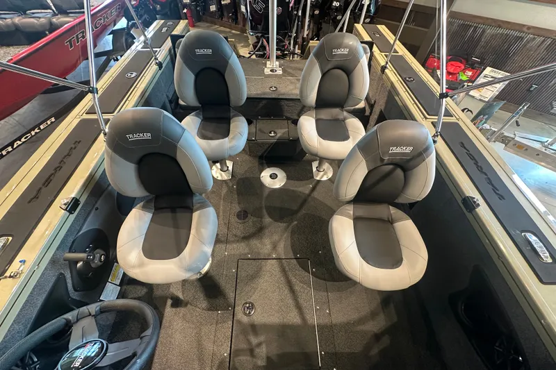 Slide: The Image of 2027 Tracker Targa V-18 Combo boat interior with four cushioned seats. - 15