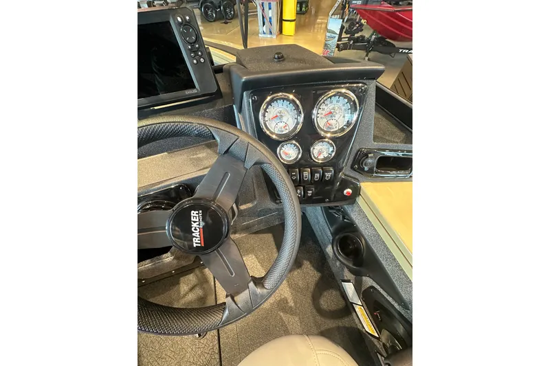 Slide: The Image of Dashboard of 2027 Tracker Targa V-18 Combo boat with steering wheel and gauges. - 19