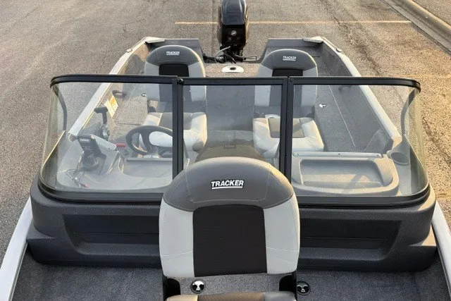 Slide: The Image of 2027 Tracker Pro Guide V-16 WT boat interior with seating and steering console. - 19