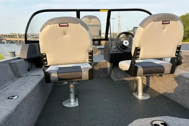 Slide: The Image of 2027 Tracker Pro Guide V-16 WT boat interior with dual seats and steering console. - 20