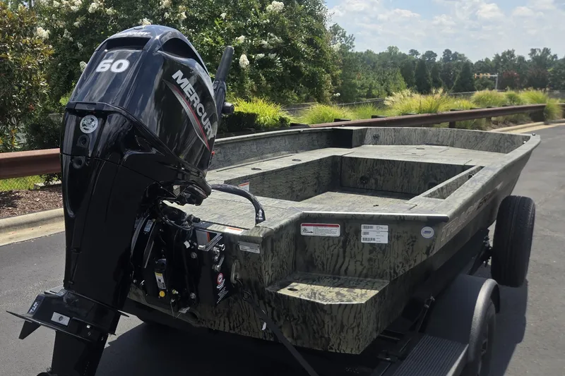 Slide: The Image of 2027 Tracker Grizzly 1860 CC boat with Mercury 60 engine on trailer. - 67