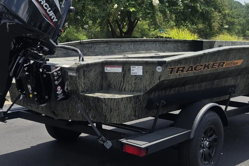 Slide: The Image of 2027 Tracker Grizzly 1860 CC boat on trailer with Mercury engine. - 66