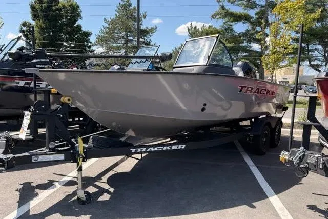 The Image of 2027 Tracker Targa V-18 Combo boat on trailer in parking lot. - 0
