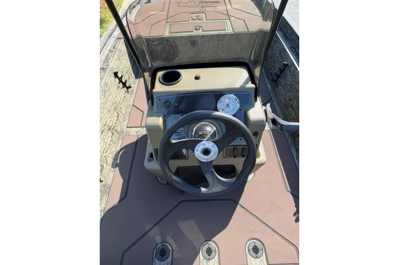 Slide: The Image of Steering console of 2027 Tracker Grizzly 1860 CC boat with gauge and controls. - 13