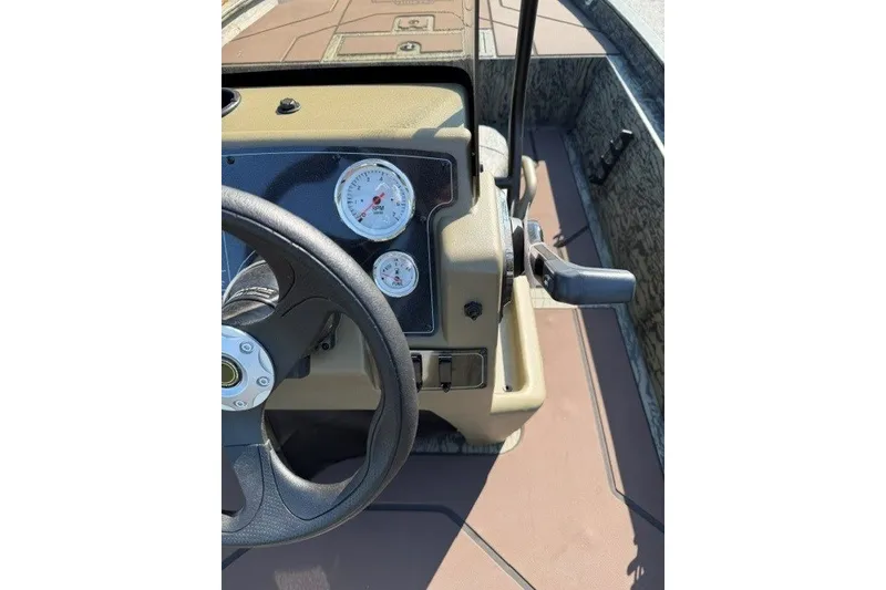Slide: The Image of Steering console of 2027 Tracker Grizzly 1860 CC boat with gauges and controls. - 15