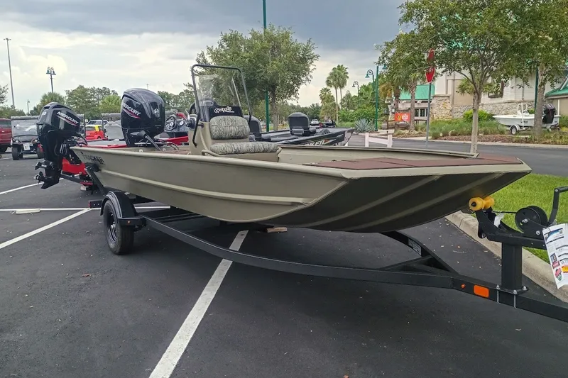 The Image of 2027 Tracker Grizzly 1860 CC boat on trailer in parking lot. - 0