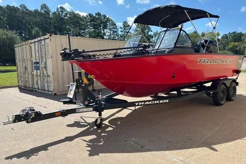 The Image of 2027 Tracker Targa V-18 Combo boat on trailer, parked outdoors. - 0
