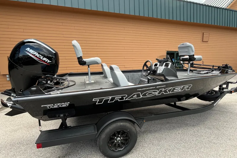 The Image of 2027 Tracker Pro Team 195 boat with Mercury engine, parked on a trailer. - 0
