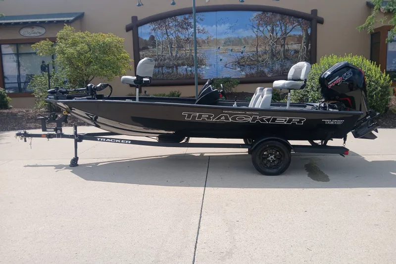 The Image of 2027 Tracker Pro Team 190 boat on trailer, parked outdoors. - 0