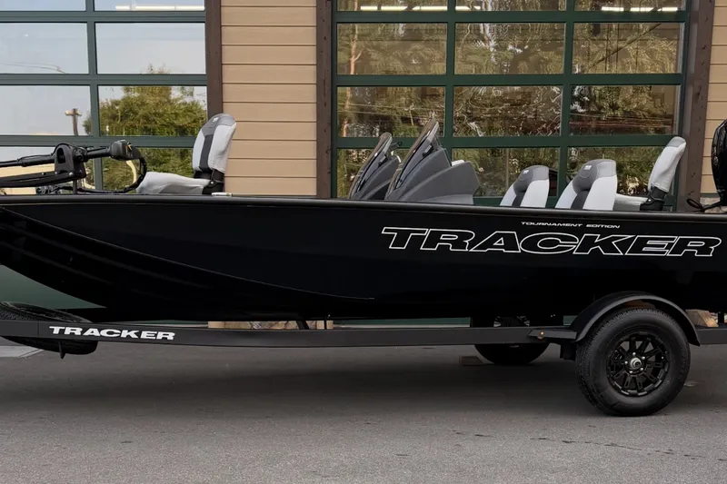 The Image of 2027 Tracker Pro Team 195 boat, black exterior, parked on trailer. - 0