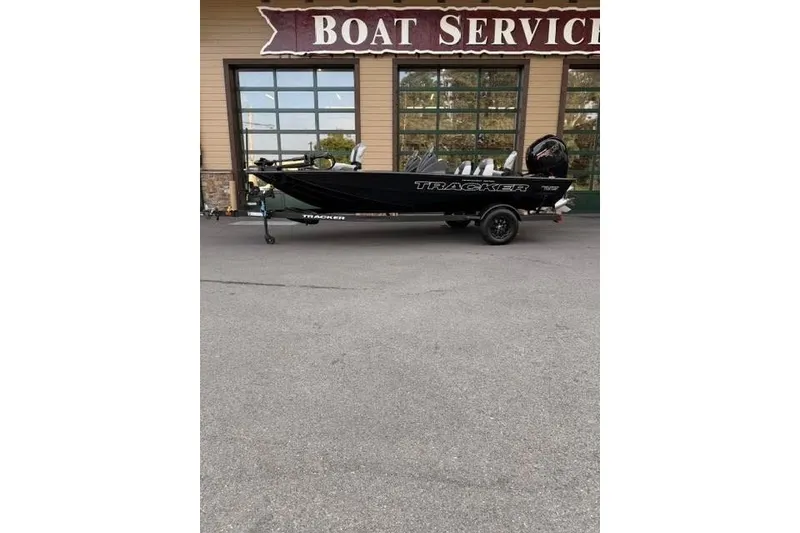 The Image of 2027 Tracker Pro Team 195 boat parked outside a boat service center. - 0