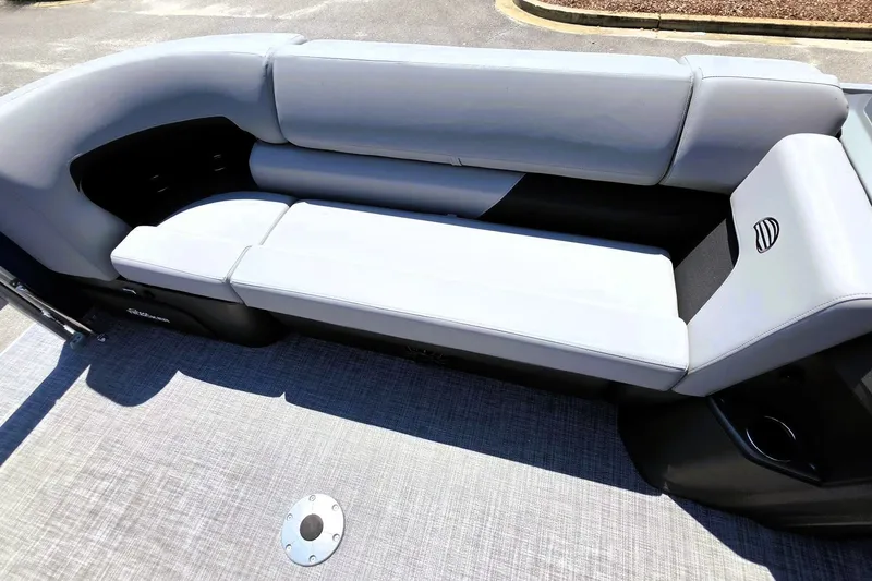 Slide: The Image of 2027 Sun Tracker SportFish 22 DLX boat interior with gray cushioned seating. - 18