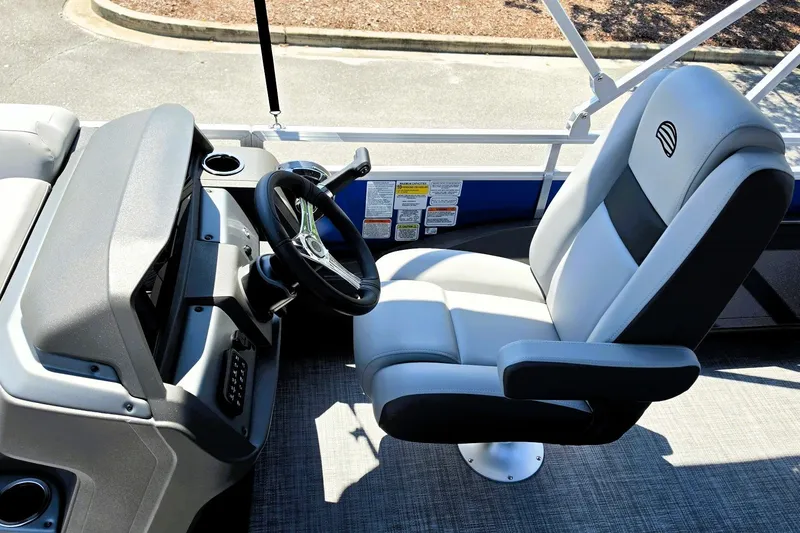 Slide: The Image of Captain's chair and helm of 2027 Sun Tracker SportFish 22 DLX pontoon boat. - 13