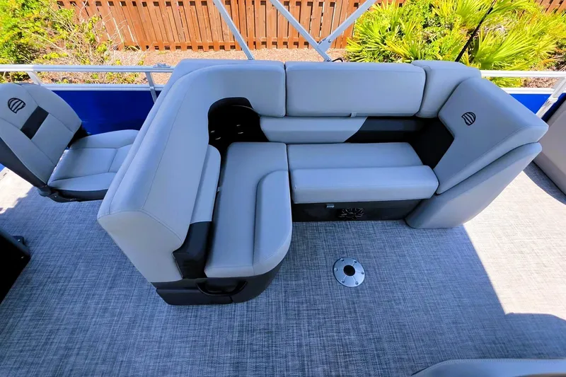 Slide: The Image of 2027 Sun Tracker SportFish 22 DLX boat interior with gray seating and modern design. - 16
