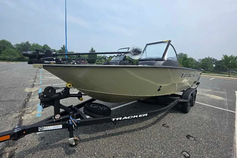 The Image of 2027 Tracker Targa V-18 Combo boat on trailer in parking lot. - 0