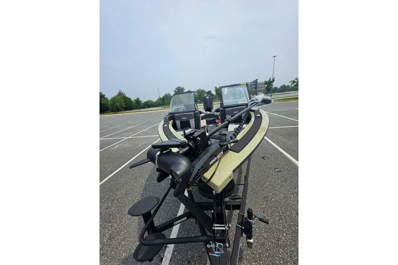 Slide: The Image of 2027 Tracker Targa V-18 Combo boat in parking lot, featuring Minn Kota trolling motor. - 46