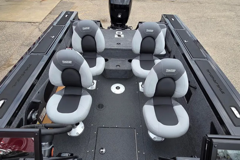 Slide: The Image of 2027 Tracker Targa V-18 Combo boat interior with four cushioned seats. - 48