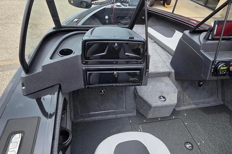 Slide: The Image of Interior of 2027 Tracker Targa V-18 Combo boat, featuring modern dashboard and seating. - 44