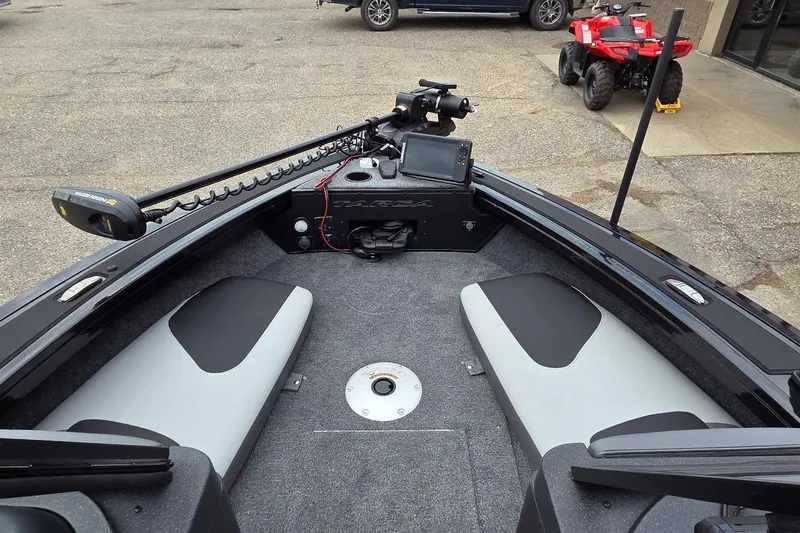Slide: The Image of 2027 Tracker Targa V-18 Combo boat interior with seating and navigation equipment. - 45