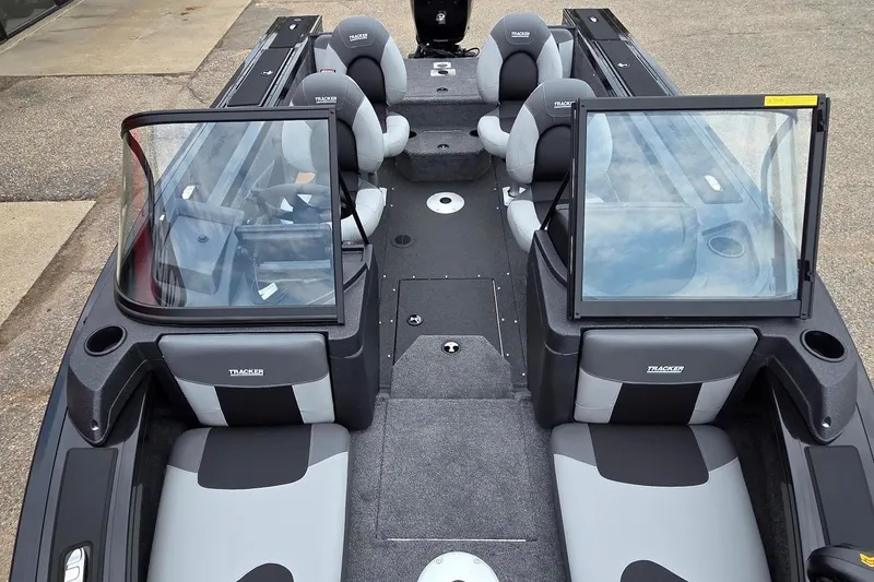 Slide: The Image of 2027 Tracker Targa V-18 Combo boat interior with seating and windshield, showcasing modern design. - 47