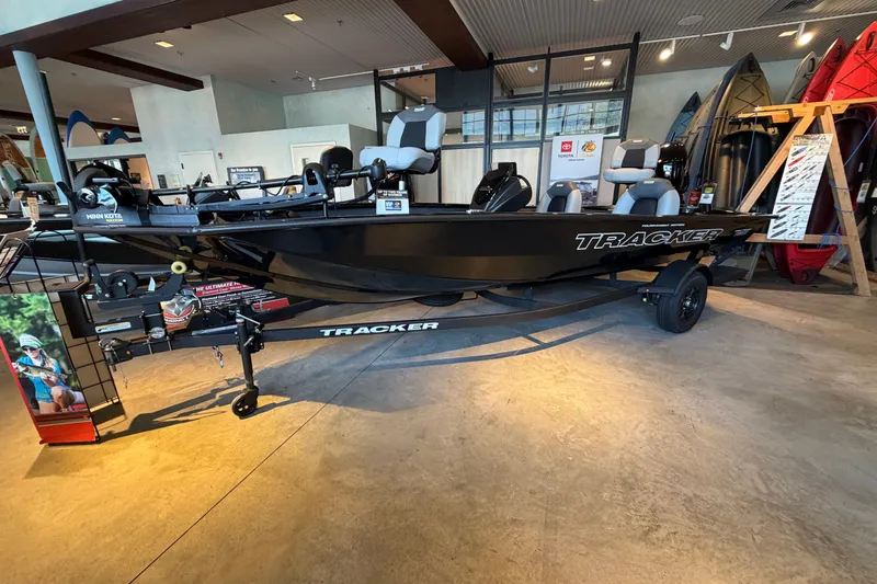 The Image of 2027 Tracker Pro Team 190 boat displayed indoors on a trailer. - 0