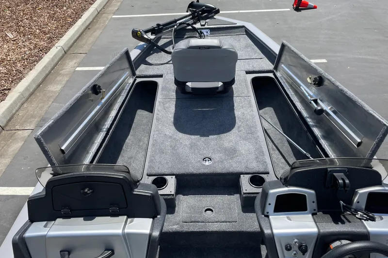 Slide: The Image of 2027 Tracker Pro Team 190 boat interior with open storage compartments and seating. - 19