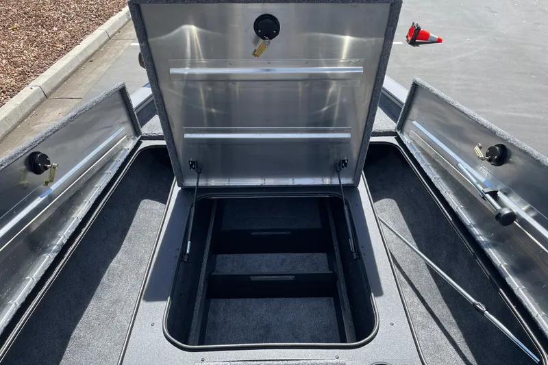 Slide: The Image of Open storage compartments on a 2027 Tracker Pro Team 190 boat. - 22